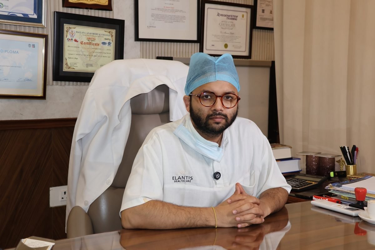 Dr. Mannan Gupta seated at his desk in the clinic office